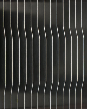 metallic cpu cooler heatsink fins full frame texture, vertical silver metal plates with smooth finish in repeating geometric pattern, closeup macro view, technology cooling concept