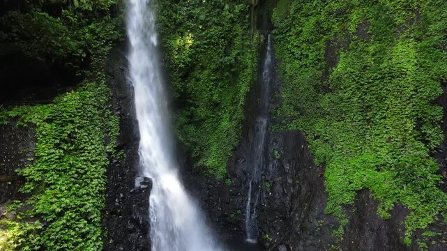 Drone View of Wonderful Hidden Pete Waterfall in Tropical Forest, Central Java Indonesia