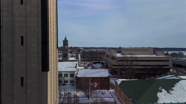 Aerial corridor in Springfield Massachusetts with snowy rooftops and American flag