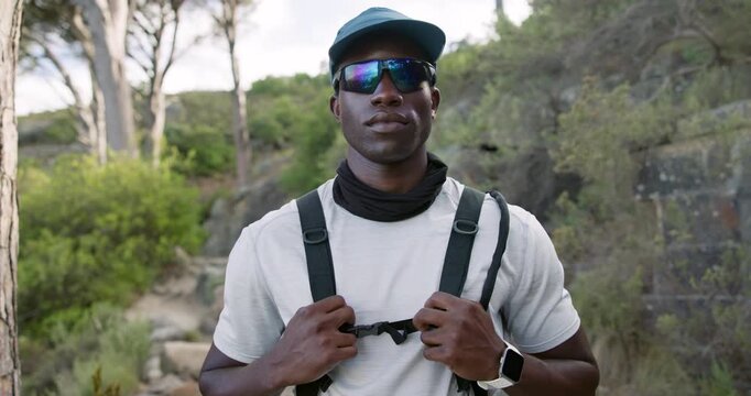 Fitness, face or hiker in forest with gear, pride or progress in outdoor workout. Sport, portrait and black man in nature with sportswear, trekking exercise or training confidence in body improvement