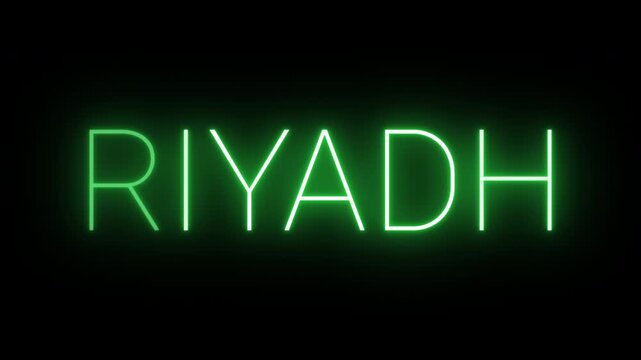 Flickering neon green glowing riyadh sign animated on black background.