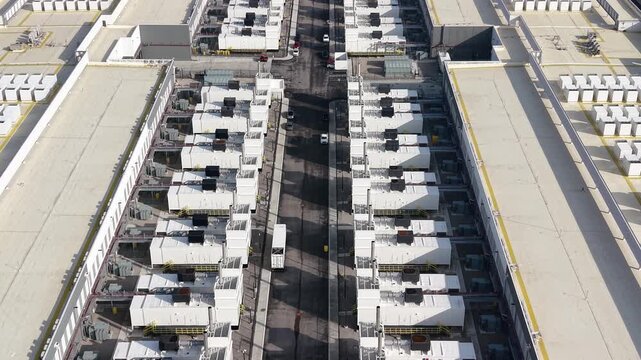 Aerial view of a large data center complex with servers modules and power generators.