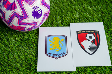 Fototapeta premium Aston Villa vs. AFC Bournemouth Premier League football game, official match ball on lush green pitch, wallpaper with copy space.