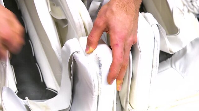 Hockey player preparing pads before game