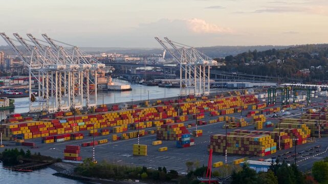 Aerial view of cargo containers and gantry cranes at a shipping terminal in Seattle
