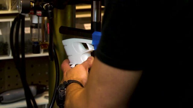 Hockey technician working on skates