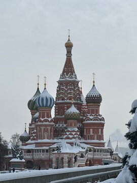 St Basil's Cathedral on Red Square in winter, Moscow, Russia. It is an old landmark of Moscow. Vertical view of St Basil's church during snowfall in the Moscow center. Ancient architecture of Moscow.