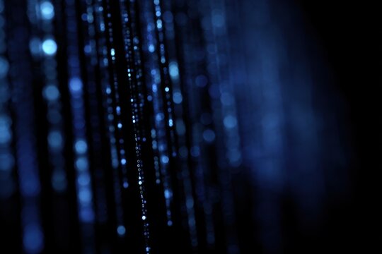 Abstract 3D binary code falling like rain, matrix style, blue and black