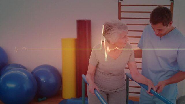 Therapist checking grip supporting, senior woman taking PT steps on parallel bars while ECG pulsing