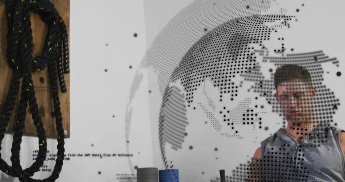 Vertical video: Male athlete gripping handle and pulling for fitness, dotted globe obscuring torso