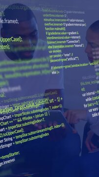 Pair reviewing tablet, one pointing, initiating other interacting, code overlay growing for review
