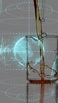 Vertical video: Glass jar filling from above, droplet falling, splashing, tech globe overlaying jar