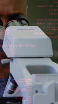 Vertical video: Lab tech peering scope as python code growing, causing UI highlights for analysis