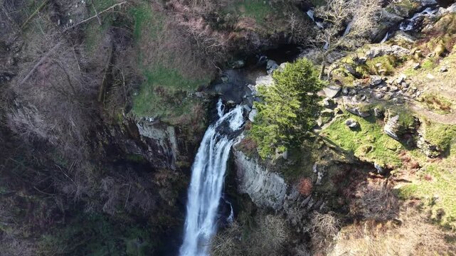 Spectacular Pistyll Rhaedr waterfall in HDR by drone - pan fast rotate from top, North Wales, UK