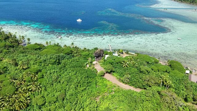 Finger of God Rock and Tropical Lush of Bora Bora Island, French Polynesia, Drone Aerial View