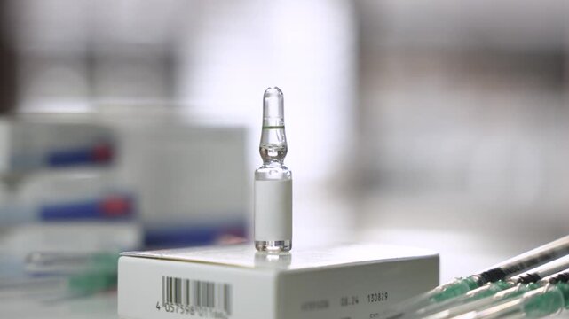 Camera Pull Back of Glass Ampoule with Syringes, Injectable Medicine Concept