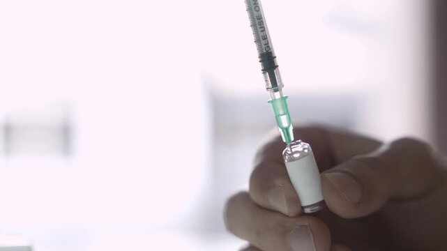 Fingers Holding Glass Ampoule, Syringe Drawing Medicine, Injectable Medicine Concept