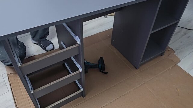 Building a simple desk from parts at home in the living room on a Saturday afternoon