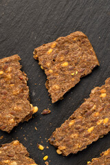 thin natural hard dry rye flour loaves with flax seeds and wheat fiber, natural healthy loaves from a complex of ingredients for dietary