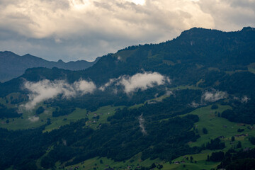 Fototapeta premium Scenic summer view of Alpine village. Switzerland. Alpine landscape with lake in Stansstad. Lake Lucerne. Vierwaldstatersee. Switzerland, Panoramic view on green Alps and lake Lucerne.
