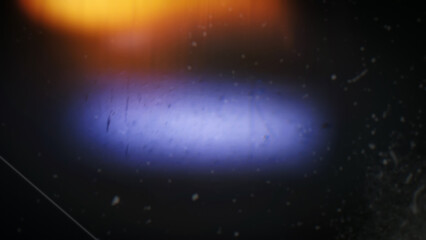 Obraz premium Abstract distressed film burn texture with warm light leak, scratches, dust, and dark vintage gradient. Retro photo overlay background design