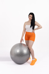 Fototapeta premium Woman posing on a fitness ball