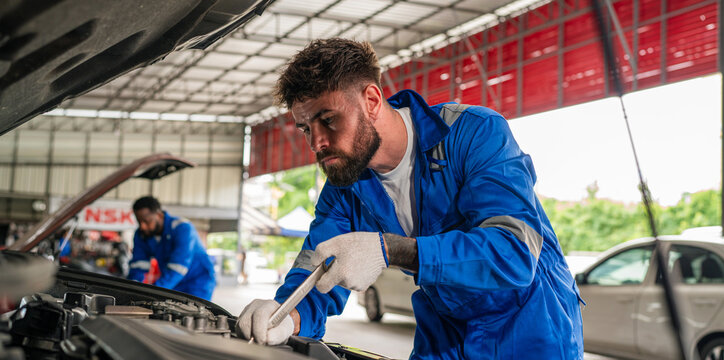 Generated Team Auto mechanic are checking and repair maintenance auto engine is problems at car repair shop.