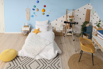 Fototapeta premium Interior of stylish children's room with bed, planet toys, table and modern telescope