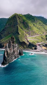 Atlantic Ocean coastline of Madeira Island featuring large sea stacks and rugged coastal rock formations