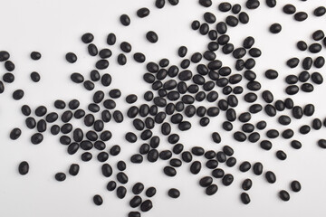 Black soybeans on a white background.