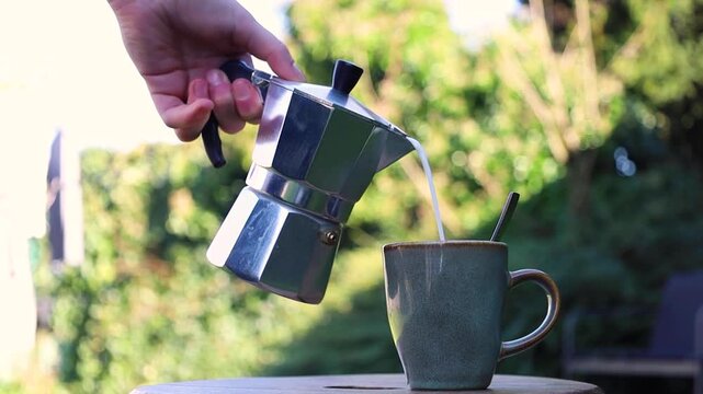 Video pouring milk into a cup of coffee.