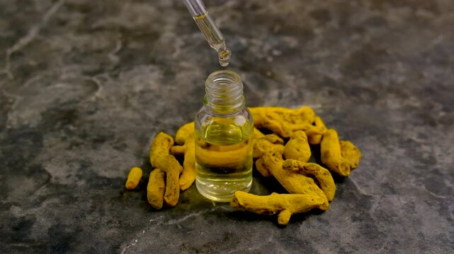 Turmeric root for supplements and essential oils. Selective focus.
