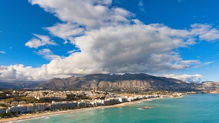Obraz premium Altea coastline with church, beach and mountains under dramatic clouds, Costa Blanca, Alicante, Spain