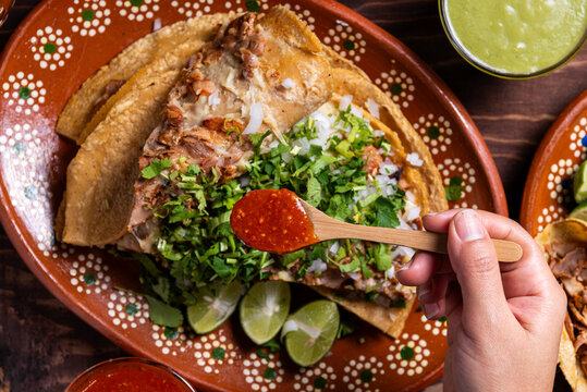 Overhead Close-up Delicious Tacos with Spicy Sauce on a Decorated Plate. Gringa.