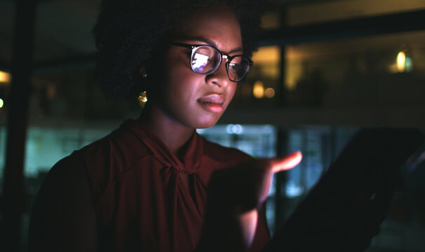 Review, night or black woman in agency with tablet, draft edit or email feedback for article. Digital, specs or journalist in office with technology, fact check or industry research on late shift.