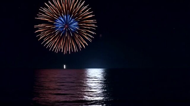 Colorful fireworks light up the night sky above calm waters, creating a festive and vibrant atmosphere.