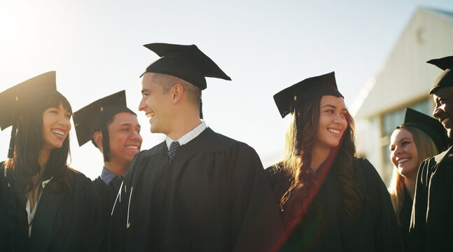 Graduation, outdoor and group of students with college goal, achievement or award celebration. Happy, scholarship and people with education success for development, growth or study at university.