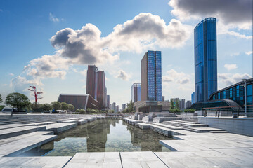 Captivating Urban Landscape with Reflections and Skyscrapers Under a Blue Sky