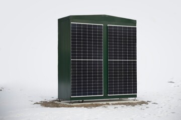 New electric utility boxes with solar panels next to a snowy walkway