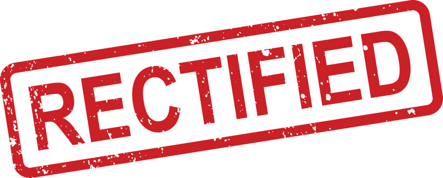 A red rectangular grunge textured rubber stamp prominently features the word RECTIFIED on a crisp white surface
