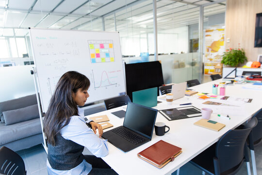 Businesswoman preparing a presentation at the office table