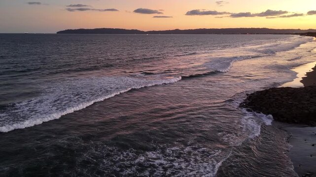 Aerial view of the breakwater from above at Kemiren Beach, Cilacap, 4K