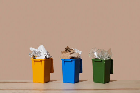 Three household recycling bins for waste separation and sustainability