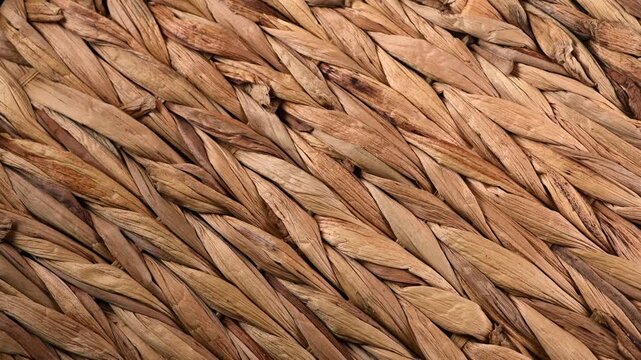 Wicker texture, rattan rotating, closeup. Braided Cane background, surface. Natural environment friendly ecological material, DIY