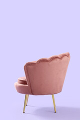 Beautiful pink armchair on lilac background, back view