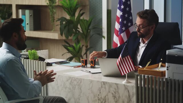 U.S. embassy employee rejecting man's visa application, stamping denied seal