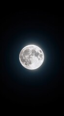Fototapeta premium A glowing full moon in a cloudless space. The moon's relief is visible. Close-up