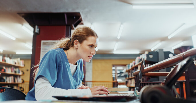 Laptop, woman and medical student in library with study, browsing and research for university exam. Person, reading or learning in college with computer, knowledge or higher education for healthcare.