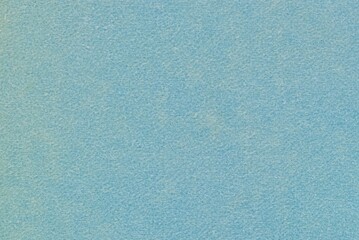Soft Light Blue Felt Texture Background with Fine Grainy Surface © cristographic