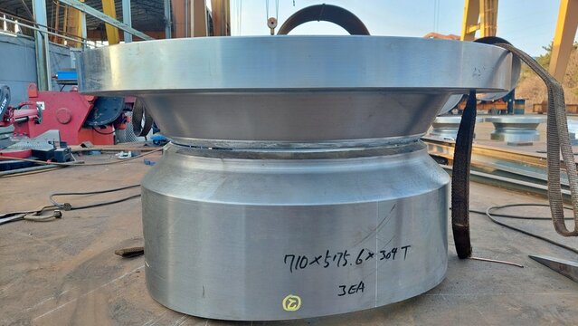 Large machined steel flanges for industrial piping system in workshop